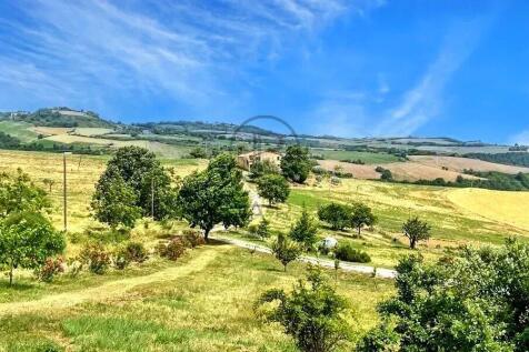 A picturesque rural landscape with rolling hills,