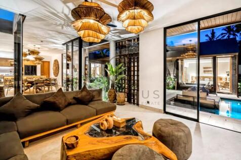 Modern living room with wooden decor, plush sofas,