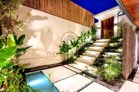 Luxurious entrance with illuminated stone steps, s