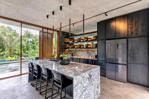 Modern kitchen with a marble island, sleek black c