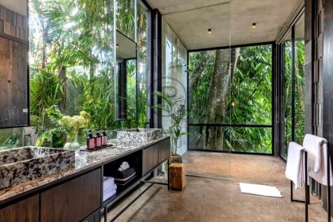 Modern bathroom with large glass windows showcasin