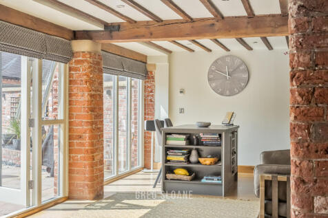 Open-plan living space towards kitchen
