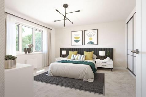 A generously sized double bedroom with storage space