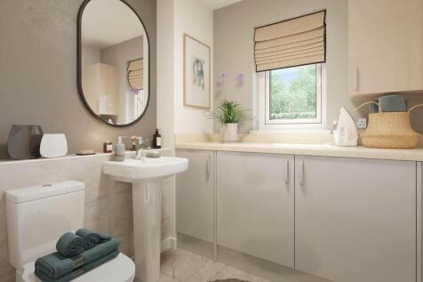 The guest cloakroom hosts space for laundry appliances