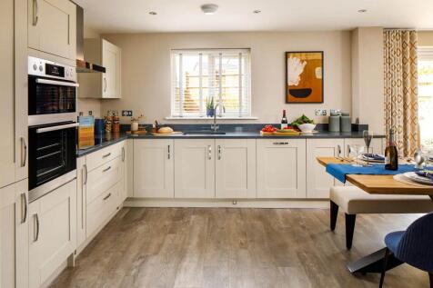An open plan, modern kitchen is ready to go from the day you move in