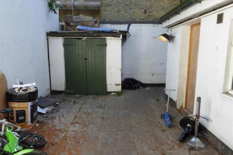 Patio and storage area for shops