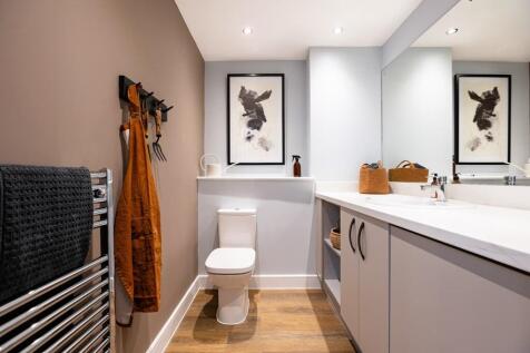 A downstairs toilet and utility room adds convenience