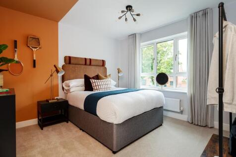 A second double bedroom sits to the front of the home