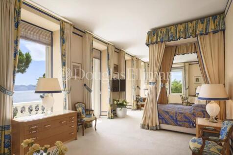 Luxurious bedroom with ornate blue and gold decor,