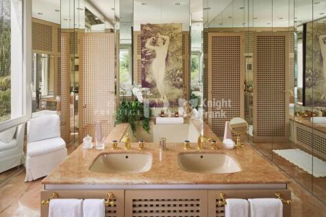 Luxurious bathroom with dual sinks, marble counter