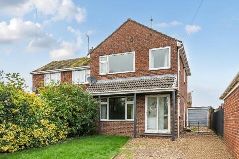 front and driveway leading to garage