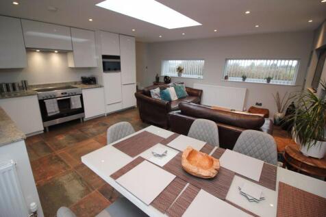 open plan lounge dining room and kitchen