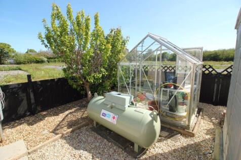 greenhouse and lpg storage tank