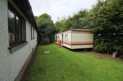 side garden and storage caravan