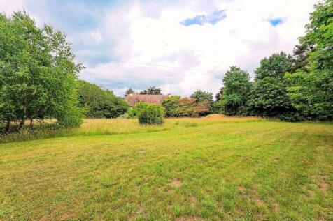 The Meadow with a distant view of the...