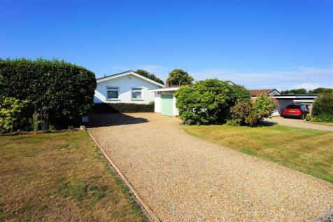 The drive, garage, carport and bungalow