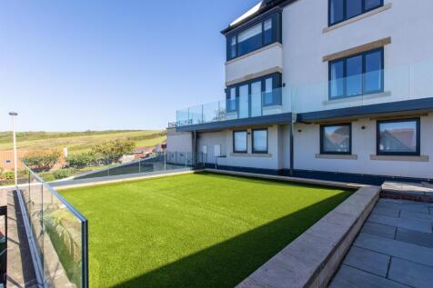Garage laid with artificial grass