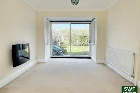 THROUGH LOUNGE/DINING ROOM