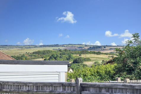 CLOSE UP DOWNLAND...