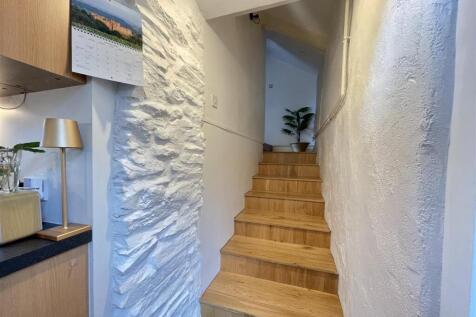With Stairs from the Kitchen