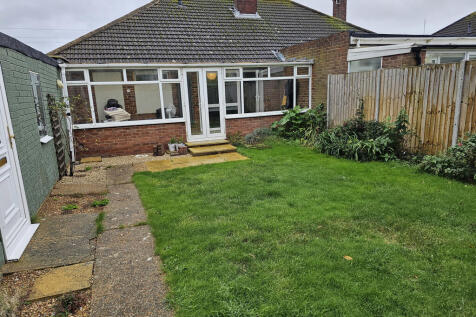 View of conservatory and garage from garden 