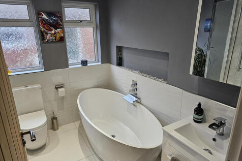 Bathroom with bath and separate shower