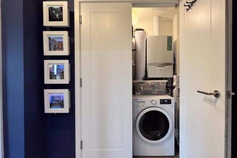 Large utility cupboard with washer dryer