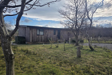 The approach to one completed lodge