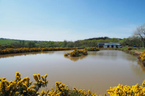 Across the lake, a lodge under construction