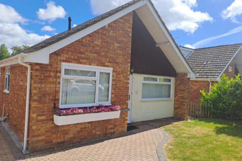 Front of house with garden and drive