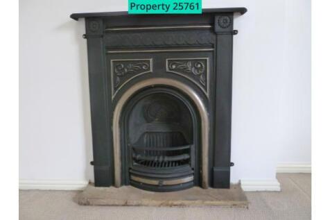 Ornamental fireplace in main bedroom