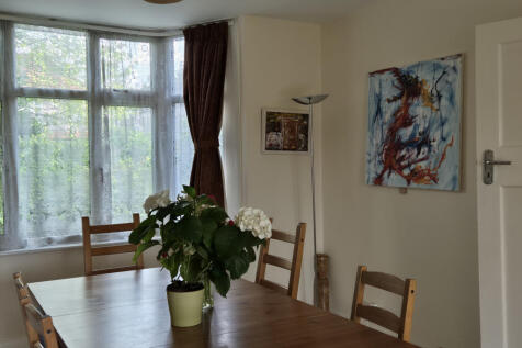 Living/dining room looking towards front garden