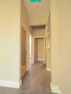 Hall from lounge with storage shelves