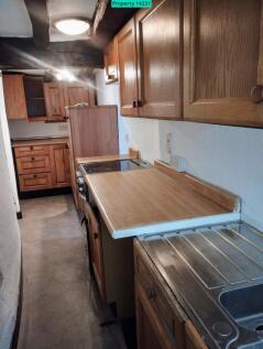 Galley kitchen undergoing partial refurbishment
