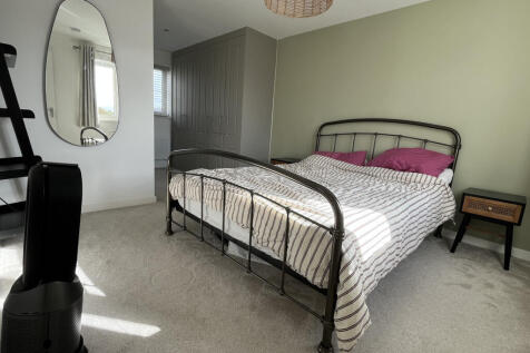 Dual aspect master bedroom with fitted wardrobes