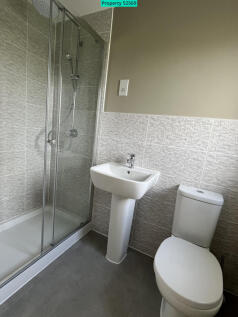 En-suite bathroom with double width shower cubicle