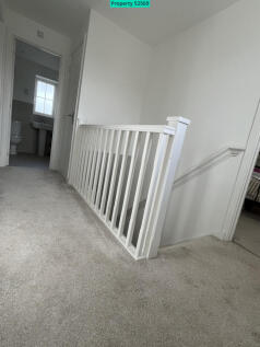 Spacious hall with large storage cupboard