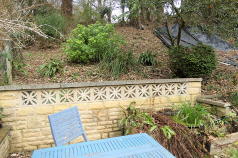 Back garden patio and hillside garden