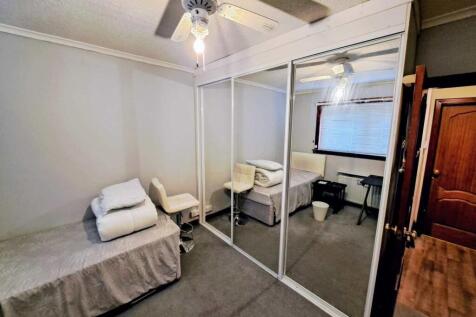 Bedroom showing mirrored wardrobes