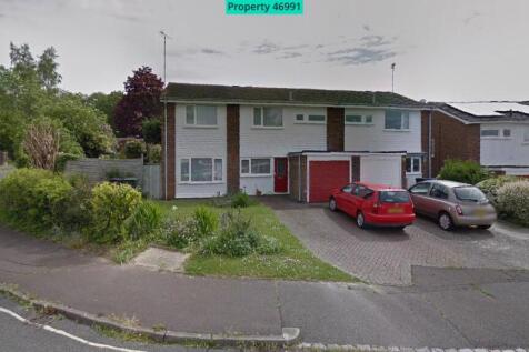 Front, side and rear garden.  Space for 4 cars