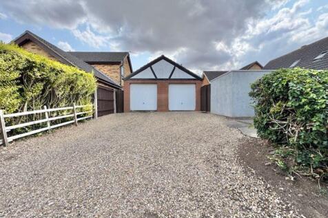 Detached double garage and parking