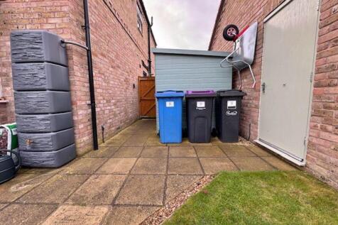 Garage and bin store