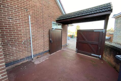 Double gates for security leading to garage