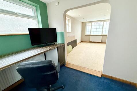 study opening to reception room