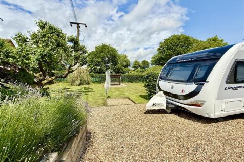 driveway leading to space for caravan