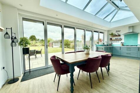 kitchen day rom with bi fold doors to patio