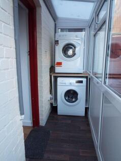 Covered area with washing machine and...
