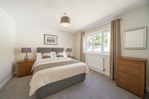 Bedroom has been virtually staged with furnishings