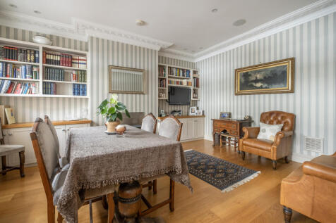Dining Room with Stylish Cornice and Feature Fireplace