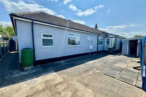 Rear Patio with access to front and workshop